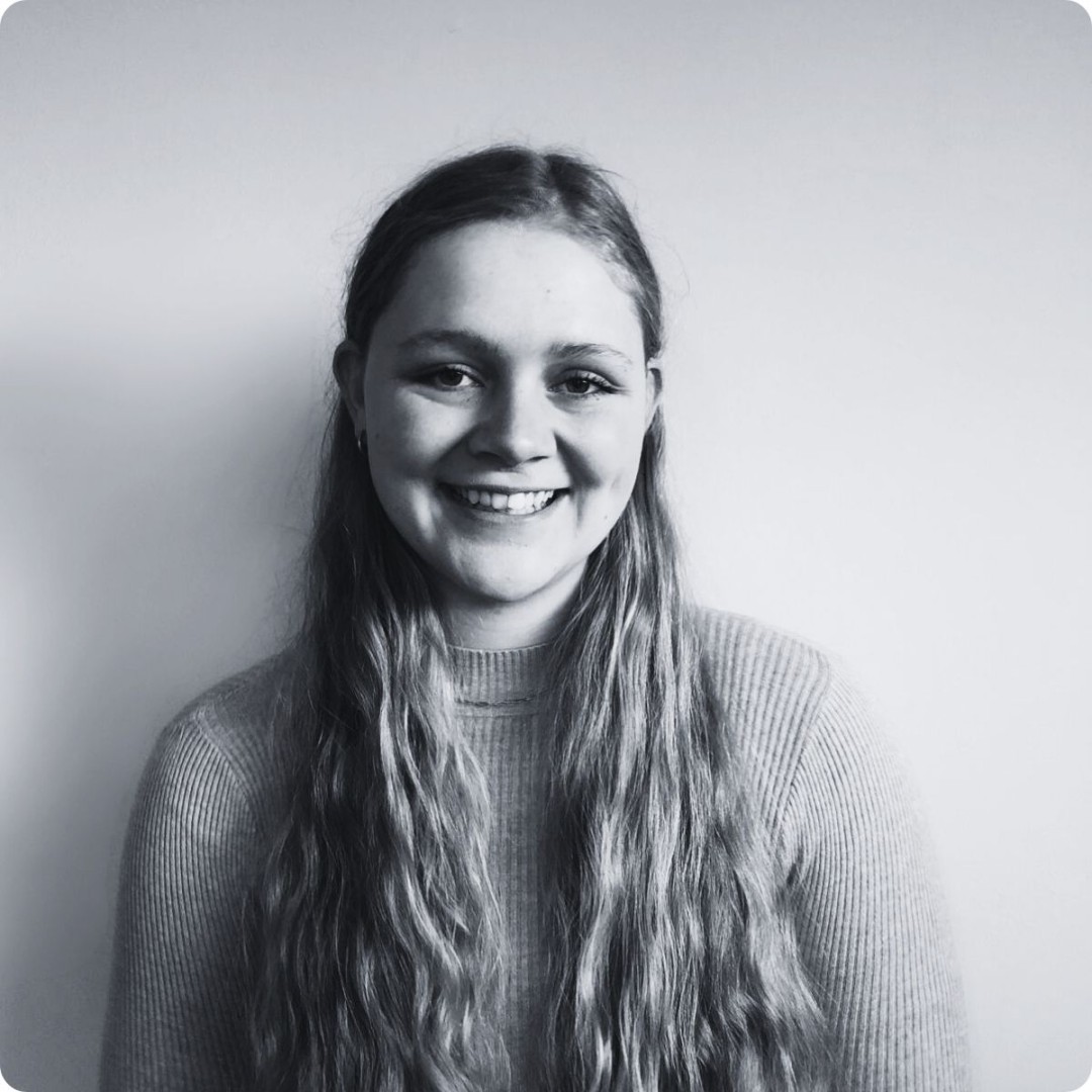 Smiling young woman with long blonde hair