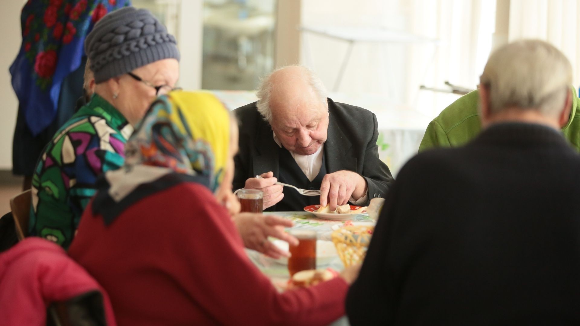 Elderly individuals having a meal