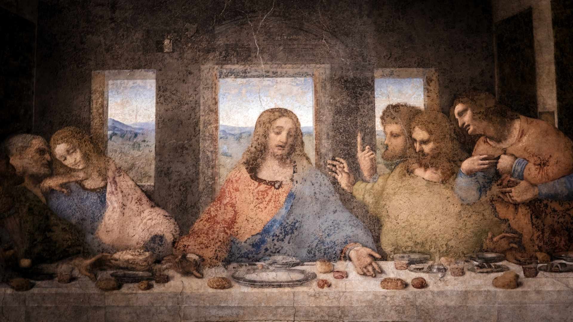 Artistic portrayal of Jesus sharing the Last Supper with his disciples around a table