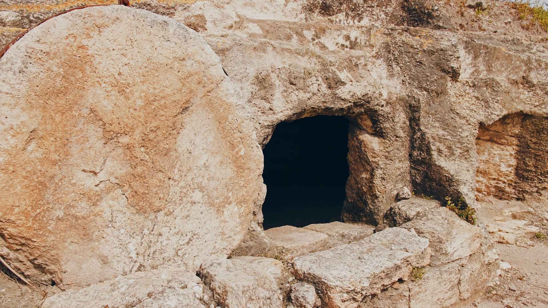 Empty tomb with a large stone rolled away.