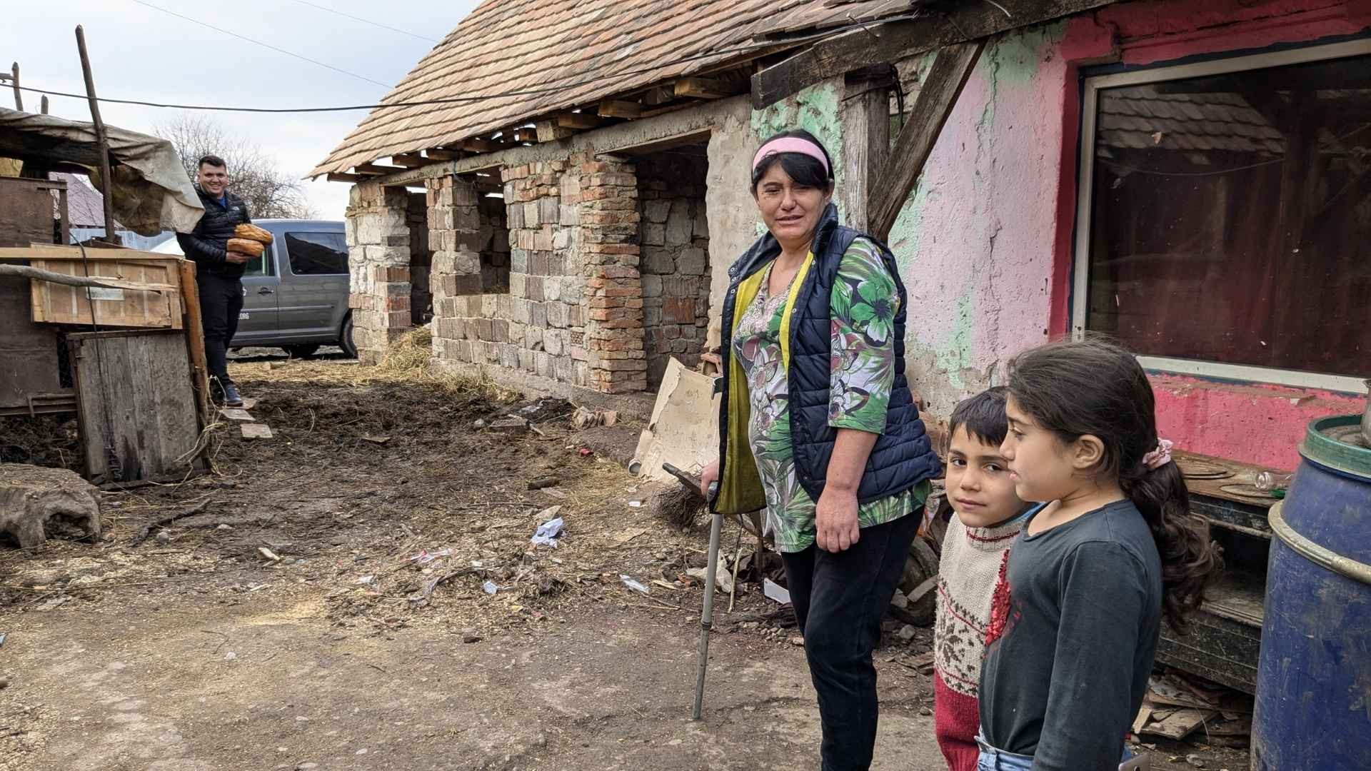 Cosmin delivers freshly baked bread to a family in need